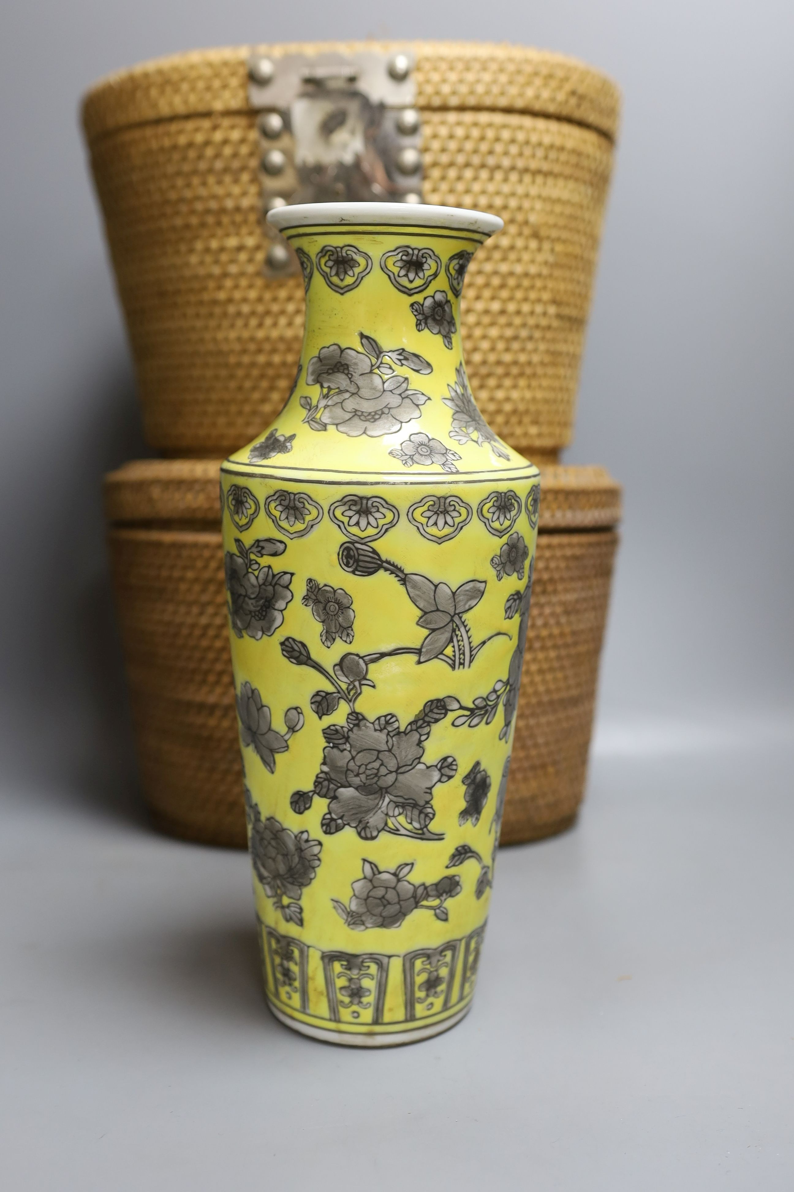 Two wicker-cased Chinese porcelain teapots together with a Chinese celadon dish and yellow vase, 28cm tall, (4)